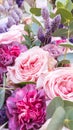 Gorgeous bouquet of roses and carnations with decorative dried flowers.