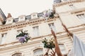 Gorgeous bride and bridesmaids throwing bouquets up in the air. bride and bridesmaid throw bouquet outdoors at wedding reception Royalty Free Stock Photo