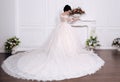 Gorgeous bride with dark hair in luxuious wedding dress Royalty Free Stock Photo