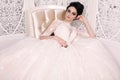 Gorgeous bride with dark hair in luxuious wedding dress Royalty Free Stock Photo