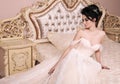 Gorgeous bride with dark hair in luxuious wedding dress Royalty Free Stock Photo