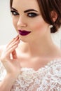 Gorgeous bride with fashion makeup and hairstyle in a luxury wedding dress Royalty Free Stock Photo