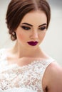 Gorgeous bride with fashion makeup and hairstyle in a luxury wedding dress Royalty Free Stock Photo
