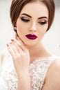 Gorgeous bride with fashion makeup and hairstyle in a luxury wedding dress Royalty Free Stock Photo