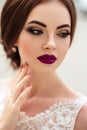 Gorgeous bride with fashion makeup and hairstyle in a luxury wedding dress Royalty Free Stock Photo