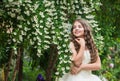 Gorgeous bride girl white dress flowers blooming background, wedding decor concept Royalty Free Stock Photo