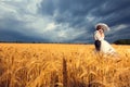 Gorgeous bride and groom in wheat field with blue sky in the bac Royalty Free Stock Photo