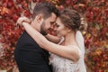 Gorgeous bride and stylish groom gently hugging and smiling at w Royalty Free Stock Photo