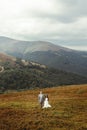 Gorgeous bride and stylish groom posing, boho wedding couple, l