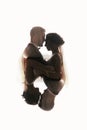 Gorgeous bride and stylish groom silhouettes gently hugging. Double exposure of sensual wedding couple embracing. Romantic moment