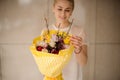 Gorgeous bright easter bouquet in hands of young blonde woman