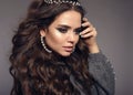 Gorgeous brunette portrait. Beauty makeup. Pearls jewelry women set. Curly long hair style. Manicured nails. Sensual girl model Royalty Free Stock Photo