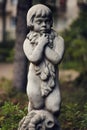 Gorgeous buttery smooth bokeh of Voigtlander 75mm. Vintage stylization of photo. Statuette with detailed reliefs
