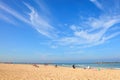 Gorgeous calm blue sea and Tel Aviv free sand beaches. People enjoy autumn mild season. They sunbathe and swim