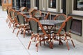 Gorgeous cane chairs and tables outside restaurant Royalty Free Stock Photo