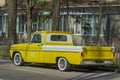 Gorgeous classic yellow 1965 GMC pickup truck parked outdoors on a sunny day. Royalty Free Stock Photo