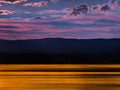 Gorgeous colors of the sunset over Lake Geneva, the reflection of the setting sun in the water, the atmosphere of peace and Royalty Free Stock Photo