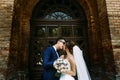 Gorgeous couple and amazing door behind