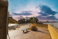 A gorgeous day at Mud Island Park along the Mississippi river with a red brick footpath, green benches, bare winter trees Royalty Free Stock Photo