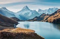 Gorgeous evening panorama of Bachalp lake / Bachalpsee, Switzerland. Exotic autumn sunrise in Swiss alps, Grindelwald, Bernese Obe