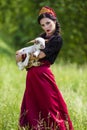 Gorgeous Fashion Model in Russian Style Kokoshnik Holding Newborn Lamb Cub Against Nature Background Royalty Free Stock Photo