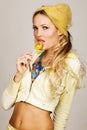 Gorgeous fashionable young woman holding a lemon c Royalty Free Stock Photo