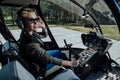 Gorgeous female helicopter pilot being about to start flight