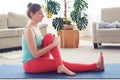 Gorgeous female meditating and starching muscles on yoga mat Royalty Free Stock Photo