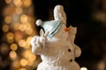 Gorgeous figurine toy snowman with small white animals on it