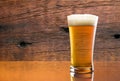 Gorgeous Glass Of Delicious Beer With Barn Wood Background