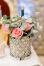 Gorgeous glass vase holds pink pastel roses