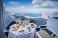 Gorgeous greek breakfast in idyllichotel varanda with sea and caldera view of Santorini, greece