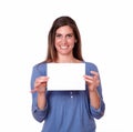 Gorgeous hispanic woman holding white card