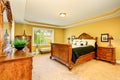 Gorgeous Interior of master bedroom with carved wood bed Royalty Free Stock Photo