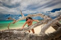 Gorgeous inviting tropical Cuban beach and ocean with pirate handsome man in foreground