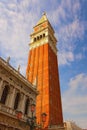 Gorgeous landscape view of medieval St. Mark`s Campanile bell tower of St. Mark`s Basilica against sunny autumn sky Royalty Free Stock Photo