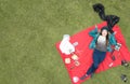 Gorgeous Latina student , picnic in the park, aerial view, available space for editing