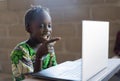 Adorable African Little Girl Surprised Looking at Laptop Computer Technology Royalty Free Stock Photo