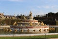 Gorgeous and luxury fountain with gold statues in Versailles Castle yard in Paris, France