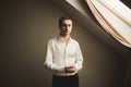 Gorgeous man, groom prepares for wedding ceremony in luxury hotel Royalty Free Stock Photo