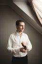 Gorgeous man, groom prepares for wedding ceremony in luxury hotel Royalty Free Stock Photo