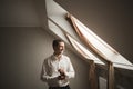 Gorgeous man, groom prepares for wedding ceremony in luxury hotel Royalty Free Stock Photo