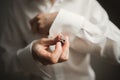 Gorgeous man, groom prepares for wedding ceremony in luxury hotel Royalty Free Stock Photo