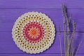 Gorgeous Mandala Crochet Doily and Lavander Flowers Royalty Free Stock Photo