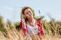 Gorgeous middle aged woman listening to music outdoors Royalty Free Stock Photo