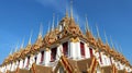 Gorgeous multi-tiered Loha Prasat with golden spires