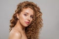 Gorgeous natural beauty without retouching. Perfect redhead woman with long healthy shiny wavy red hair. Beautiful curly hair