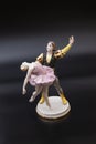 Gorgeous old figurine of a ballerina and her partner performing the adagio (slow part of the dance).