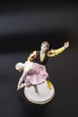 Gorgeous old figurine of a ballerina and her partner performing the adagio (slow part of the dance).