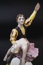 Gorgeous old figurine of a ballerina and her partner performing the adagio (slow part of the dance).